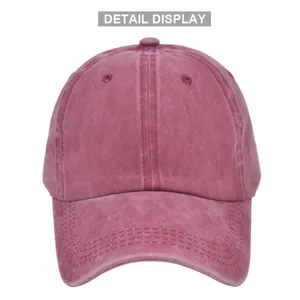 Détail d'une casquette vintage en coton délavé avec trous d'aération en rouge foncé
