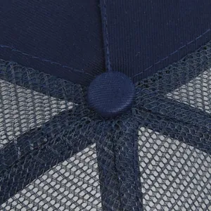 Close-up of navy blue baseball cap crown showing stitch quality and breathable mesh fabric