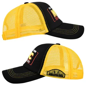 Detailed side view of black and yellow NYC trucker hat with 3D embroidery and mesh back
