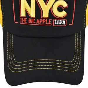 Detailed close-up of 3D NYC embroidery and yellow mesh on a black baseball cap