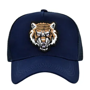Navy blue trucker hat with detailed tiger head embroidery and breathable mesh back panel