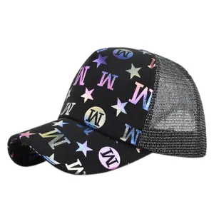 Detail of black mesh trucker hat featuring colorful gradient M and star print designs
