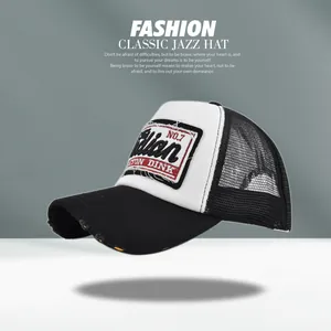 Close-up of vintage embroidered patch on breathable mesh baseball cap with distressed brim