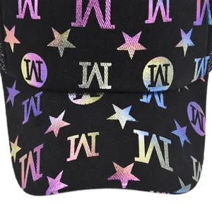Macro view of black baseball cap featuring colorful gradient star and M letter prints