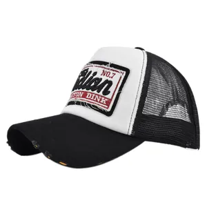 Detailed embroidery on vintage trucker hat featuring breathable mesh and distressed brim design