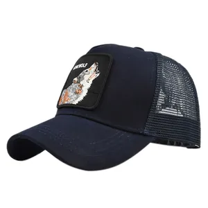 Detail of embroidered lone wolf patch on dark blue mesh trucker hat with lonewolf text