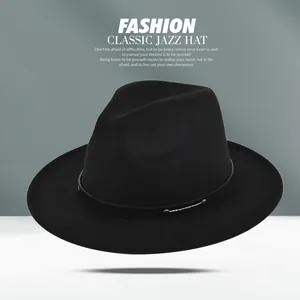 Detail of black wool fedora featuring a slim leather band with metal rivet accents
