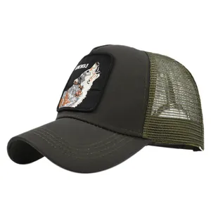 Close-up of wolf patch embroidery and breathable mesh on dark green trucker hat