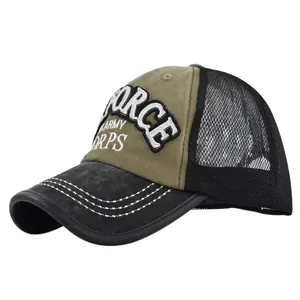 Detail of embroidered U.S. ARMY lettering on military green trucker cap with mesh