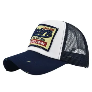 Detailed view of the vintage mesh baseball cap featuring 3D Western embroidery and frayed brim