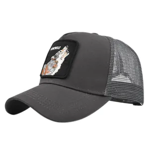 Macro view of Lonewolf wolf patch embroidery and breathable mesh on dark grey trucker hat