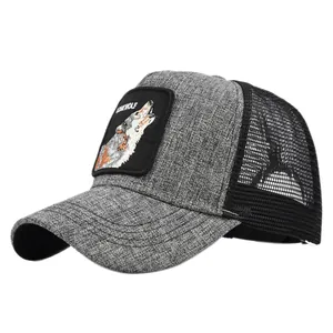 Close-up of wolf patch embroidery on grey mesh trucker hat with breathable fabric detail