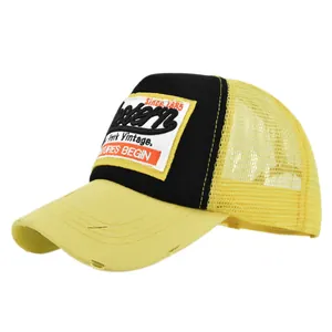 Western vintage trucker hat with yellow mesh and black embroidered patch on white background