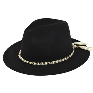 Detail of black wool fedora with pearl gold chain and off-white tassel accents