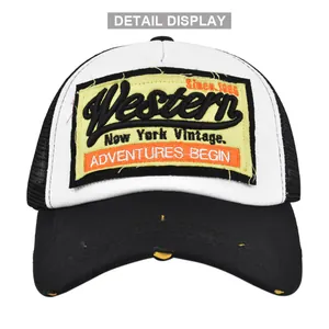 Close-up of Western adventure patch and distressed brim on breathable trucker hat
