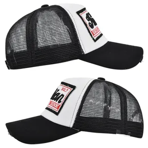 Detail of 3D embroidery patch and breathable mesh on a distressed trucker cap