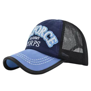 Detail of embroidered FORCE patch on navy mesh truck cap with breathable back