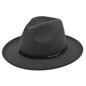 Detail of dark gray felt fedora hat featuring black leather band and silver studs