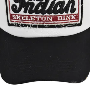 Macro detail of Indian Skeleton Dink patch embroidery on mesh trucker baseball cap