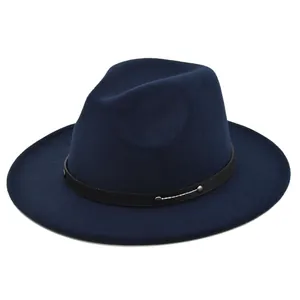Detail of navy blue felt fedora with a black studded leather band and classic teardrop crown