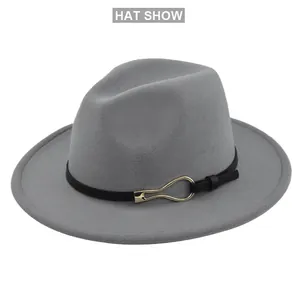 Detailed top view of grey wool fedora hat with black band and gold ring buckle
