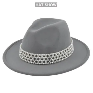 Detailed view of grey wool fedora hat featuring a woven pearl beaded decorative band