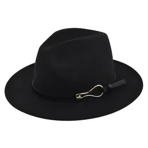 Detailed close-up of a black wool fedora featuring a vintage leather band and gold buckle