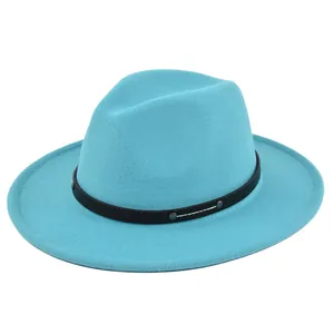 Detailed shot of teal fedora hat featuring black leather band with silver metal studs