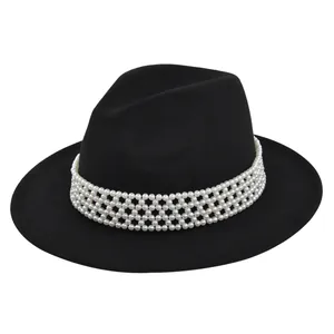 Detailed view of black wool fedora featuring layered white pearl beaded decorative band