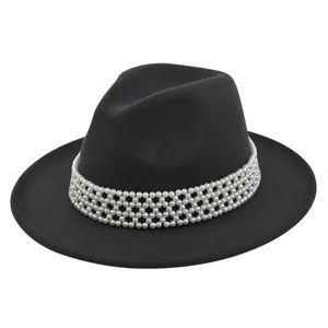 Detail view of high-quality black wool fedora featuring a multi-layered pearl band