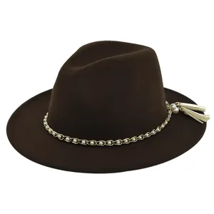 Detail of dark brown wool fedora with gold chain, white pearls and side tassel accents