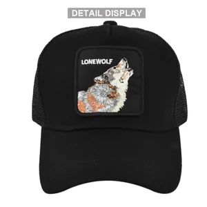 Close-up of the Lonewolf embroidery patch and breathable mesh texture on this black trucker hat