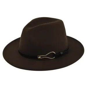 Detail of dark brown wool fedora featuring a black leather band and golden buckle