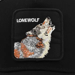 Black mesh trucker hat featuring a detailed Lone Wolf animal embroidery patch on the front