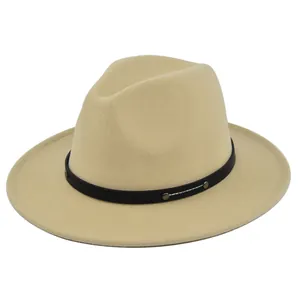 Close-up of beige wool fedora hat with black rivet leather band and white stitching