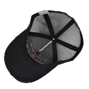 Macro view of mesh trucker hat interior featuring washing label and quality stitching details