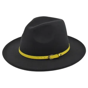 Detail of black wool fedora hat featuring a contrast yellow leather strap with silver buckle