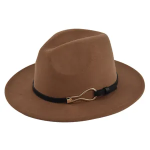 Detailed texture of brown wool felt fedora featuring black leather band and gold buckle