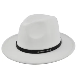 Detailed macro of white wool fedora hat featuring black leather band and silver metal buckle