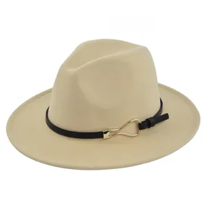 Close-up of beige fedora hat with black leather strap and gold horseshoe metal buckle