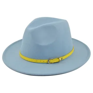 Close-up of light blue wool fedora hat featuring a bright yellow leather belt buckle