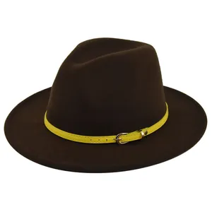 Detail of dark brown wool fedora hat featuring a bright yellow leather strap with metal buckle