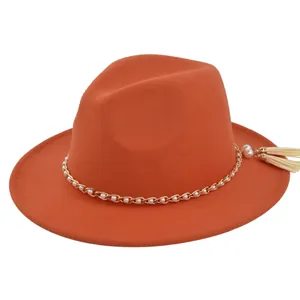 Orange fedora hat featuring a gold chain with white pearls and stylish side fringe detail
