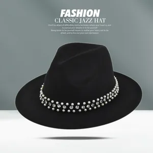 Detail of a black wool jazz hat with elegant double-row pearl and rhinestone embellishments