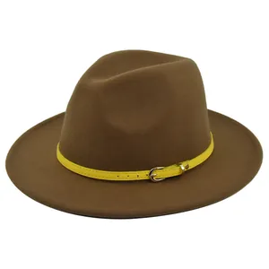 Detail of dark brown wool fedora hat featuring a bright yellow leather belt buckle strap