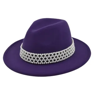 Detail of purple wool fedora hat featuring a premium five-row white pearl decorative band