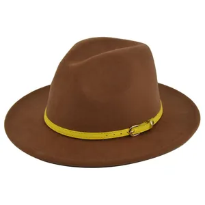 Close-up of brown wool felt fedora featuring a yellow leather belt buckle detail
