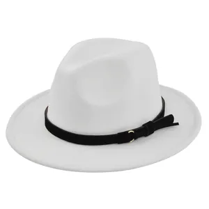 Detail of white fedora hat felt texture with black band and gold buckle accent