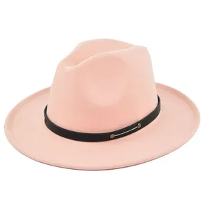 Close-up of pink wool felt fedora featuring black leather band and silver studs