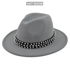 Detailed view of gray wool fedora hat featuring black band with pearls and rhinestones